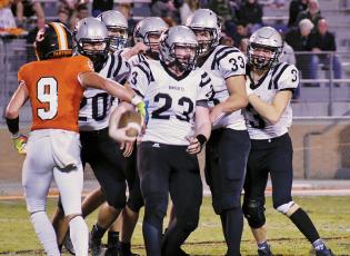 Lenoir City’s Zane Ward (9) jogs off as Robbinsville’s Dalton Hill, Eddie Brooms, Cuttler Adams, Kage Williams and Isaac Wiggins (back, from left) swarm Briley Tolbert (23), following Tolbert’s second-quarter interception Friday night. The Black Knights would pull ahead during the ensuing possession and never looked back, besting the Panthers 35-19. Photos by Kevin Hensley/sports@grahamstar.com