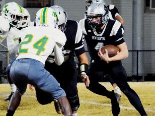 Cuttler Adams maneuvers through the North Rowan defense on Friday. Adams broke the Robbinsville High School rushing record for a single game in the victory, charging to 377 yards and four touchdowns. Photo by Art Miller/amiller@grahamstar.com