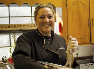 Willow Tree Catering and Baking owner and Chef Shea Blalock Anderson in the  kitchen of her restaurant. Anderson emphasized that cooking with love was an  important part of preparing a Holiday meal. Photo by Charlie Benton/news@grahamstar.com