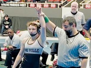 Robbinsville senior Aynsley Fink gets her hand raised Dec. 30, after winning the women’s 106-pound bracket at the annual Holy Angels showcase in Charlotte. Photo by Susan Crowe/Contributing Photographer