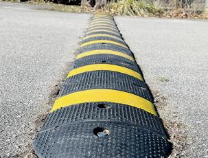 Speed bumps, like this one bolted onto Cody Street in Robbinsville, are designed to encourage drivers to slow down in a fairly-aggressive way. Photos by Randy Foster/news@grahamstar.com