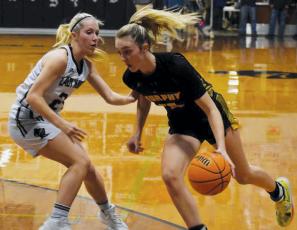 Robbinsville’s Kensley Phillips tries to slow down the progress of Murphy’s Torin Rogers on Tuesday. Photo by Justin Fitzgerald/Cherokee Scout