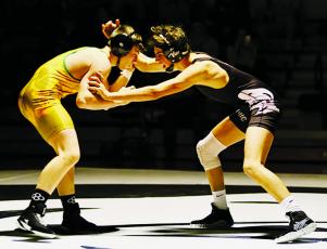 Robbinsville's Christian Phillips (right) jockeys for control with Alleghany's Cameron Worrick during Monday's second-round state dual against the Trojans. Photo by Miranda Buchanan/Robbinsville High School Yearbook