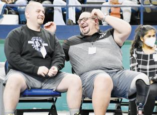 Robbinsville wrestling head coach Todd Odom (right) shares a laugh with assistant Colby White at Saturday’s state individual tournament. After 21 years as a coach, Odom  announced his retirement from the sport Sunday. Photos by Kevin Hensley/sports@grahamstar.com