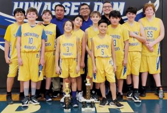 The Snowbird Mite Boys captured the 2021-22 Smokey Mountain Youth Conference tournament championship Feb. 5, after defeating Robbinsville in the title game. All names are listed from left. Front row: Whyatt Lewis, Hayden Lewis, Elijah Kirkland, Keni Wolf, Xamuel Wachacha, Elijah Lambert, Jayce Turner, Colby Kirkland, Avery Brown and Landon  Eddings. Back row: coaches Cody Teesateskie, Adam Wachacha and Zane Wachacha.