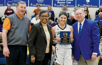 Robbinsville’s Yeika Jimenez was named the 1A West/Midwest Girls All-Star Game MVP, following her performance in Saturday’s exhibition at Highlands School. Presenting Jimenez with her award is (from left) Greg Grantham, executive director of the N.C. Basketball Coaches Association; Que Tucker, commissioner of the N.C. High School Athletic Association; and Dr. Bud Black, executive director of the 1A West/Midwest All-Star Games. Photos by Kevin Hensley/sports@grahamstar.com