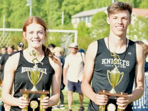 Zoie Shuler (left) and Brock Adams were named the respective Smoky Mountain Conference Most Outstanding Track and Field Girls and Boys Athlete at the conclusion of May 4’s championship meet in Cherokee. Photos by Kevin Hensley/sports@grahamstar.com