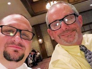 Todd Odom (left) – who just retired after coaching the Black Knights for 18 years – pauses with David Haney at a banquet in Asheville. Haney has been named as Odom’s successor, which will be the fourth time Haney has been the head coach of the Robbinsville wrestling program.