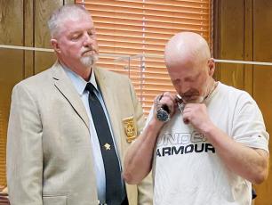 Graham County Jail Adminstrator Marlon Jackson (left) looks on as Bryan Aaron Berryman turns in his necklace and watch in Graham County Superior Court on July 13. Berryman had just been sentenced to between 11-15 ½ years in prison for a litany of charges obtained in an April 2021 arrest. Photo by Randy Foster/news@grahamstar.com