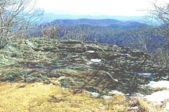 This large rock on Hooper Bald is inscribed with writing dating to 1615. Photo by Marshall McClung/The Graham Star