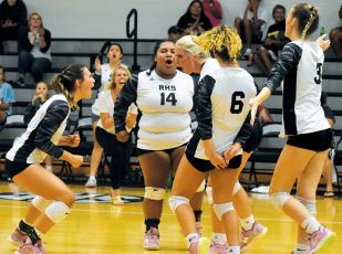 Robbinsville’s Delaney Brooms, Tai Owle, Kensley Phillips, Desta Trammell and Claire Barlow (from left) erupt after a decisive kill Sept. 1 against Murphy. The Lady Knights handed the Bulldogs a 4-set loss. Photo by Justin Fitzgerald/Cherokee Scout