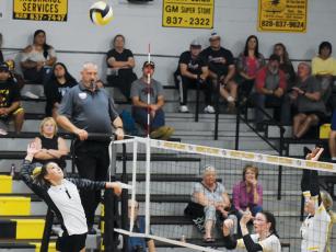 Robbinsville’s Delaney Brooms (1) springs to a kill attempt during Tuesday’s road conference match at Murphy. The Lady Knights dropped the match in four sets and are now tied with the Lady Bulldogs atop the divisional standings. Photo by Justin Fitzgerald/Cherokee Scout