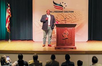 N.C. Lt. Gov. Mark Robinson delivered a lengthy message to a crowd of the roughly-200 individuals gathered at Oct. 27’s N.C. Faith & Freedom Coalition event, held inside the Robbinsville High School theater. Photo by Kevin Hensley/editor@grahamstar.com
