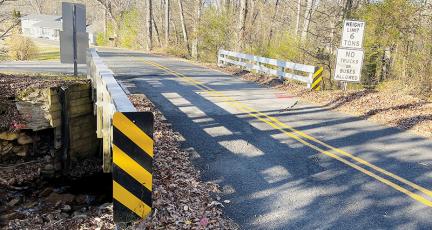 This bridge on Lower Mill Creek Road was scheduled for removal, until a Nov. 15 public hearing proved that residents wanted to keep the structure intact. The bridge was constructed in 1964 and has reached its “end-of-service,” according to the N.C. Department of Transportation. Photo by Randy Foster/news@grahamstar.com