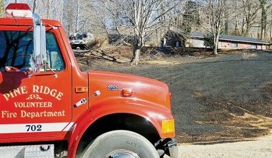 Fire engines from around the county were dispatched to a home fire in the Santeetlah area Dec. 29. Photo by Randy Foster/news@grahamstar.com