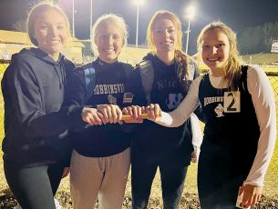 The Lady Knights’ collaboration of Katie-Lyn Gross, Kensley Phillips, Zoie Shuler and Delaney Brooms (from left) broke the 4x400, indoor-track school record Jan. 11 at Swain County, clocking in with a time of 4:34.98. The previous mark was 4:45.20, set by Ashlyn Waldroup, current coach Kaitlyn Carringer, Meghan Myler and Shawnda Martin during the 2015-16 season. Photo by Kevin Hensley/sports@grahamstar.com