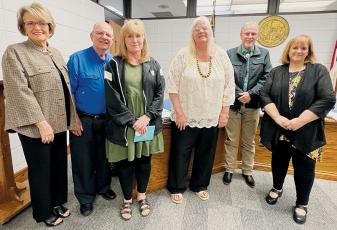 At the outset of Tuesday’s meeting, the Graham County Board of Education recognized Susie Beasley, who retired after 30 years of service to local schools. From left are school board member Pam Knott, board Chair Rodney Nelson, Beasley, school board members Debra Dinschel and Chip Carringer, and Superintendent Angie Knight. Photo by Kevin Hensley/editor@grahamstar.com