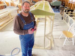 Keith McAlum builds portable chicken coops in shop space off Long Branch Road near Robbinsville. Photo by Randy Foster/Cherokee Scout