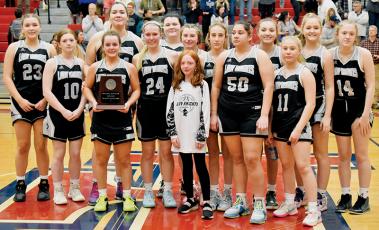 The Robbinsville Lady Knights were understandably distraught while accepting the 1A Western Regional Runner-Up plaque after dropping the game 41-30 to Bishop McGuinness. All names are listed from left. Front row: Desta Trammell, Kensley Phillips, Bella Ford, Fala Welch and Suri Watty. Back row: Liz Carpenter, Olivia Lewis, Aubrie Wachacha, Bentley Riggs, Abby Wehr, Anna Williams, Katie-Lyn Gross, Anna York and Maleah Cox. Photos by Kevin Hensley/sports@grahamstar.com