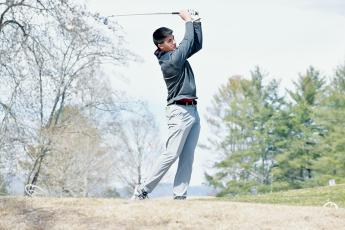 Isaiah Brown tees off on Hole No. 7 at Robbinsville’s “home” match Tuesday, which was held at Chatuge Shores Golf Course in Hayesville. Photos by Kevin Hensley/sports@grahamstar.com
