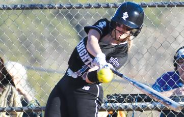 Junior Taelyr Jackson swings for an eventual double Tuesday, which was mixed into a 9-run third for Robbinsville in the Lady Knights’ 14-1 rout of Smoky Mountain. Photos by Montana Buchanan/The Graham Star
