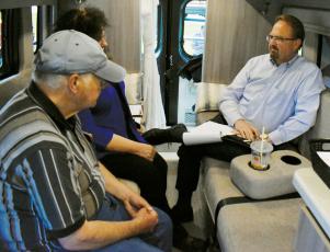 U.S. Rep. Chuck Edwards (right) meets with a pair of constituents during his “Carolina Cruiser” visit to Robbinsville on April 12. Photo by Kevin Hensley/editor@grahamstar.com