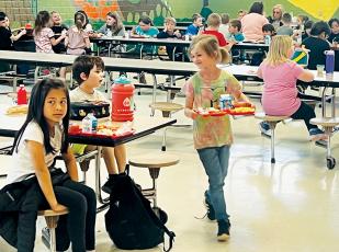 Students at Robbinsville Elementary School enjoy lunch inside the cafeteria Tuesday. It was announced Monday that pupils across the district will enjoy free breakfast and lunch for the next four years. Photo by Kevin Hensley/editor@grahamstar.com