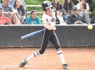 Freshman Lady Knight Anna Williams turns on a pitch during May 11's home playoff game against Elkin. Photo by Montana Buchanan/The Graham Star