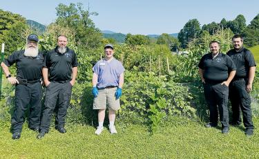 After a lot of brainstorming, ground was first broken on the Graham County EMS  garden earlier this year. From left are Bob Keber, Travis Chastain, David Maennle, Drew Silvers and Cameron Wiggins. Photos by Latresa Phillips/The Graham Star