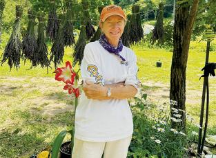 Marie’s Lavender Farm’s Sue Huskey stands proudly in front of a recently-hung crop on the grounds of the Yellow Creek establishment. Photos by Latresa Phillips/The Graham Star