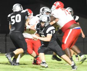 Tanner Hedden (10) weaves through traffic during Friday’s season opener against East Surry. Photo courtesy of Danielle Crabtree