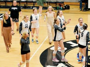 The Robbinsville Lady Knights celebrate moments after clinching a 5-set comeback win Tuesday against Asheville. Photos by Kevin Hensley/sports@grahamstar.com