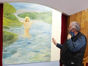 The painting over the baptism pool at Sweetwater Baptist Church is just one of many beautiful pieces of artwork hanging in sanctuaries across Graham County. Photo courtesy of Sydney Varajon/Contributing Photographer