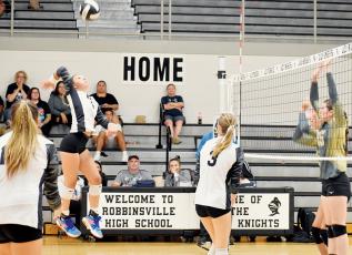 Delaney Brooms rises toward a definitive kill Tuesday against Hayesville. The senior outside hitter was a thorn in the Jackets’ side throughout Robbinsville’s win. Photo by Danielle Crabtree/The Graham Star