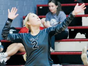 Sophomore libero Suri Watty eyes a serve during  Tuesday’s conference-tournament semifinals against Swain County. Watty’s stint at the service line in the third set sparked a 12-3 run for Robbinsville. Photo by Kevin Hensley/sports@grahamstar.com