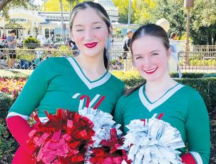 Lady Knight cheerleaders Raylee Knott (left) and Kalyn Cable recently entertained the masses at Disney World.