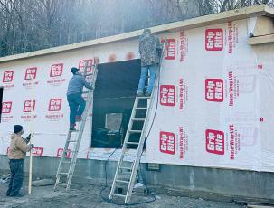 Construction on a Celebrate Recovery building off Hares Creek Road has progressed nicely since last year. Here, John Felton, Andy Girl and Doug Underwood work on the exterior. Photos by Latresa Phillips/The Graham Star