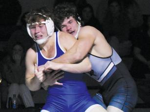Black Knights senior Kage Williams grapples with Brevard’s Ray Laney during Jan. 3’s home tri-match. Photos by Kevin Hensley/sports@grahamstar.com