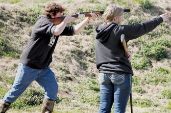 With his sister Bella looking on, Landen Eddings competes in the shotgun event at March 2’s FarWest Invitational. Photos courtesy of Cheri Lynn/Robbinsville Shooting Team