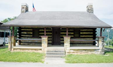 Supporters of “The Hut” sought the backing of the Graham County Board of Commissioners.  Significant progress has recently been made in the effort to preserve the historic cabin, which sits outside of Robbinsville First Baptist Church. Photo by Kevin Hensley/editor@grahamstar.com