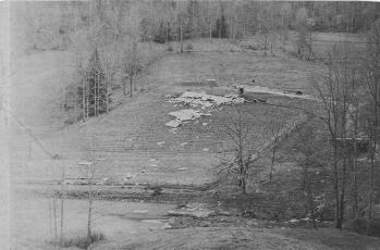 Larry McCracken’s mobile home was left scattered in a field near present-day Red Barn  Hollow General Store, in the aftermath of April 3, 1974’s tornado. Photo courtesy of The Graham Star Archives